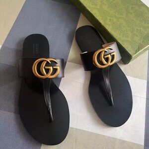 Gucci Black Sandals with Gold Emblem
